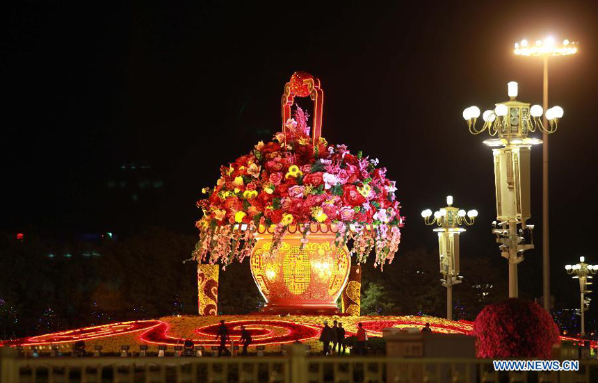 Flower decorations are seen at the Tian&apos;anmen Square in Beijing on the evening of Sept. 28. Flowers are laid on the city&apos;s streets and squares to greet the upcoming National Day on Oct. 1. 