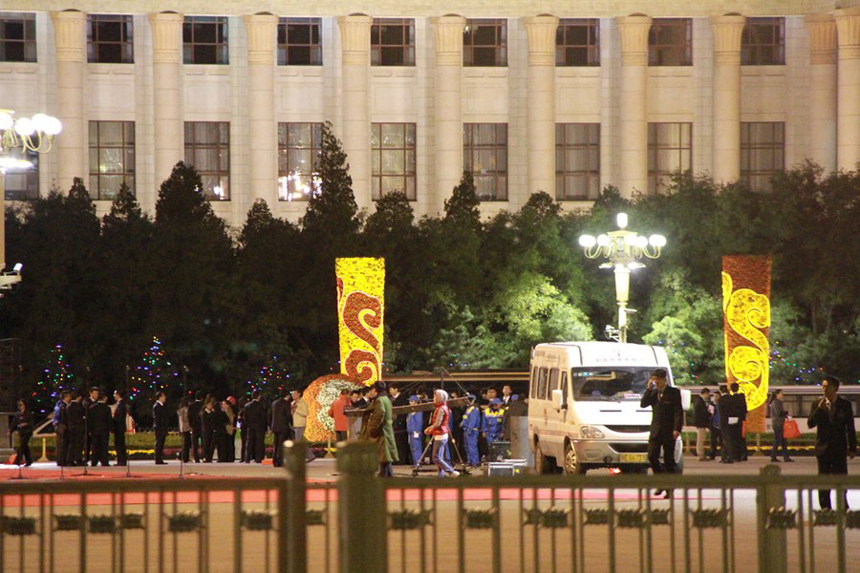 In this photo taken on Sept. 28, 2012, people attend a rehearsal on the Tiananmen Square in Beijing for the celebration of the National Day.