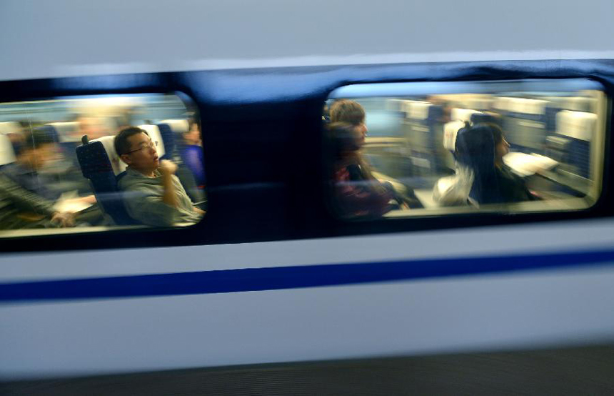 High-speed train G538, which travels to Guangzhou, leaves Zhengzhou, capital of central China&apos;s Henan Province, Sept. 29, 2012. Two high-speed train services were put into use Saturday in Zhengzhou, after the Zhengzhou-Wuhan high-speed railway opened on Friday. The new train services, G538 and G650, will reduce travel time to Guangzhou and Wuhan to six hours and two hours respectively.