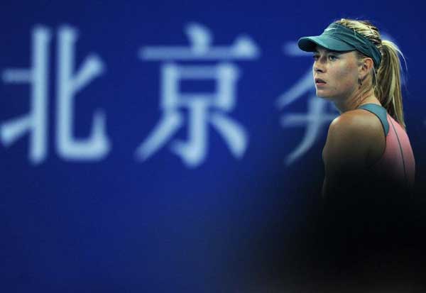 Maria Sharapova of Russia reacts during the women's first round singles match against Simona Halep of Romania at the China Open tennis tournament in Beijing, capital of China. Sharapova won 2-0. [Xinhua]