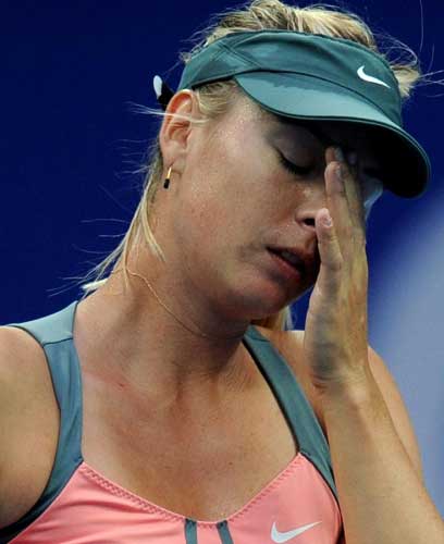 Maria Sharapova of Russia reacts during the women's first round singles match against Simona Halep of Romania at the China Open tennis tournament in Beijing, capital of China. Sharapova won 2-0. [Xinhua]