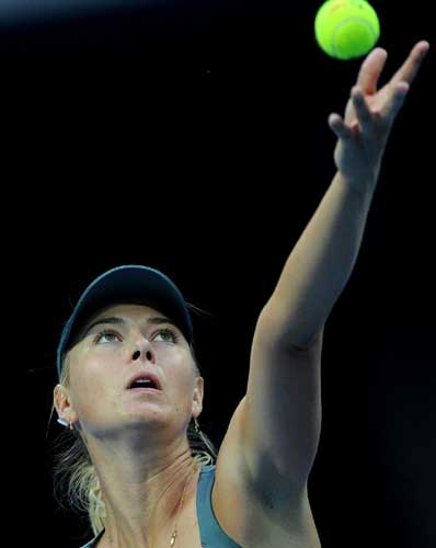 Maria Sharapova of Russia serves to Simona Halep of Romania during the women's first round singles match at the China Open tennis tournament in Beijing, capital of China. Sharapova won 2-0. [Xinhua]