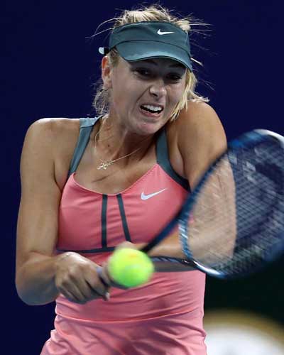 Maria Sharapova of Russia hits a return to Simona Halep of Romania during the women's first round singles match at the China Open tennis tournament in Beijing, capital of China. Sharapova won 2-0. [Xinhua]