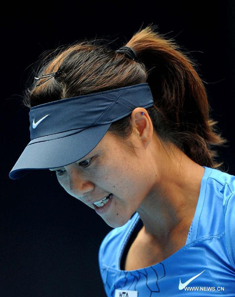 Li Na of China reacts during the women's singles 2nd round match against Nadia Petrova of Russia at the China Open tennis tournament in Beijing, China, Oct. 2, 2012. Li Na won 2-0. [Xinhua]