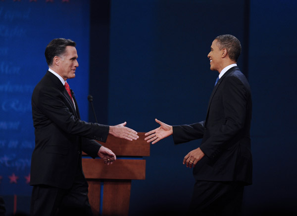 Republican presidential candidate Mitt Romney (L) shakes hands with President Barack Obama at the start of the first presidential debate at Denver University, Denver, Colorado, the United States, Oct. 3, 2012. [Xinhua]