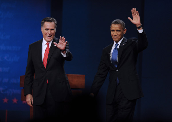 U.S. President Barrack Obama (R) and Republican presidential candidate Mitt Romney attend the first presidential debate at Denver University, Denver, Colorado, theUnited States, Oct. 3, 2012. [Xinhua]