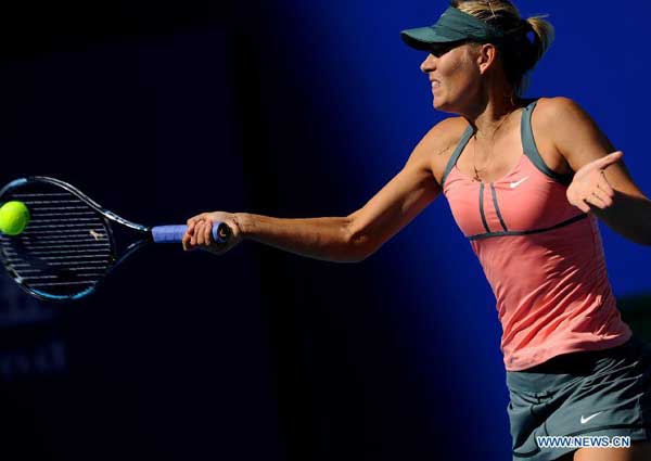 Maria Sharapova of Russia returns the ball during the women's singles 3rd round match against Polona Hercog of Slovenia at the China Open tennis tournament in Beijing, China, on Oct. 4, 2012. Sharapova won 2-0. [Xinhua]