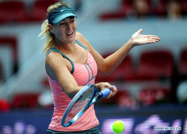 Maria Sharapova of Russia returns the ball during the women's singles 3rd round match against Polona Hercog of Slovenia at the China Open tennis tournament in Beijing, China, on Oct. 4, 2012. Sharapova won 2-0. [Xinhua]