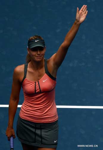 Maria Sharapova of Russia gestures to the audience after the women's singles 3rd round match against Polona Hercog of Slovenia at the China Open tennis tournament in Beijing, China, on Oct. 4, 2012. Sharapova won 2-0. [Xinhua]