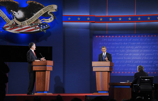 U.S. President Barrack Obama (R) and Republican presidential candidate Mitt Romney attend the first presidential debate at Denver University, Colorado on Oct. 3, 2012.