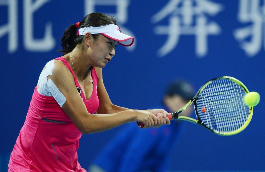 Peng Shuai of China returns the ball during the women's singles 3rd round against Li Na of China at the China Open tennis tournament in Beijing China, on Oct. 4, 2012.