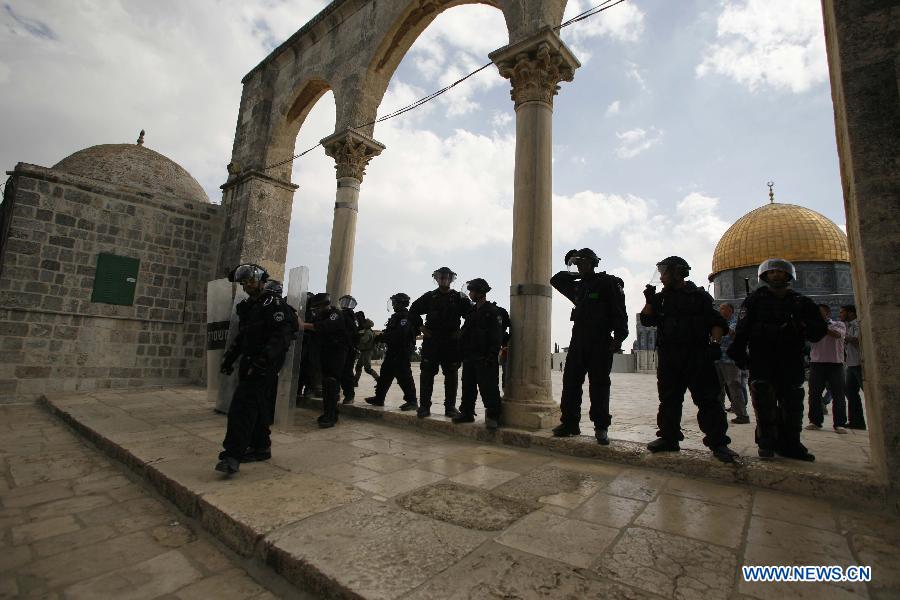 Israeli security officers secure the area outside Al Aqsa Mosque in the compound known to Muslims as Noble Sanctuary and to Jews as Temple Mount in Jerusalem's Old City, Oct. 5, 2012. Israeli police hurled stun grenades to disperse dozens of protesters outside the mosque, Islam's third holiest site, after Friday prayers. 