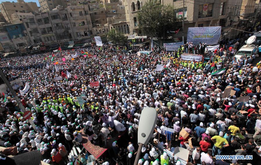 Demonstrators gather in downtown Amman, Jordan, Oct. 5, 2012. Thousands of Jordanians here on Friday called for constitutional reforms during a demonstration, which is considered the largest in Jordan since the start of Spring 2011.