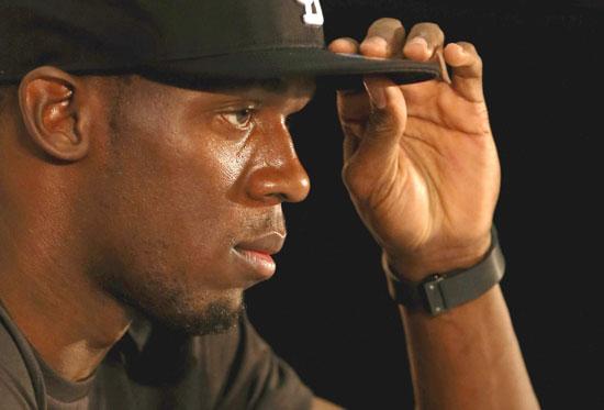 Jamacian Olympic gold medallist Usain Bolt attends a press conference before coaching a track and field clinic at AUT Millenium on October 8, 2012 in Auckland, New Zealand.