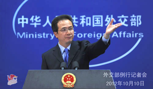 Foreign Ministry spokesman Hong Lei answers questions in a regular news conference on Oct. 10. 