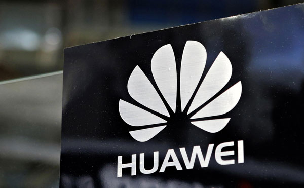 A Huawei logo is seen above the company's exhibition pavilion during the CommunicAsia information and communications technology trade show in Singapore in this June 19, 2012 file photograph. [Photo/Agencies] 