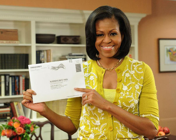 In this photo released by Obama for America via Flickr, U.S. First Lady Michelle Obama prepares her absentee ballot in Washington D.C., capital of the United States, Oct. 15, 2012.  [Xinhua/Obama for America/Jocelyn Augustino]