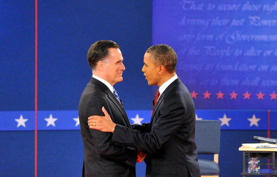 U.S. President Barack Obama greets his Republican challenger Mitt Romney on Tuesday night before their second presidential debate. [Xinhua] 