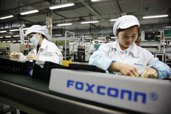 Workers in Foxconn, the world's largest electronics manufacturer. [File photo]