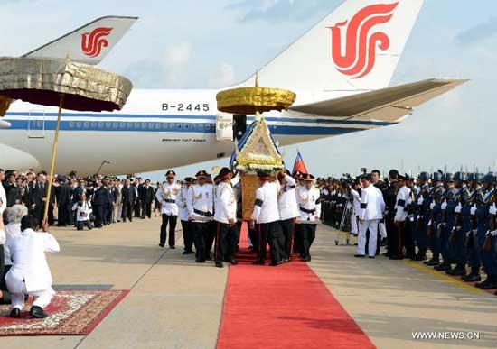 The coffin of late Cambodian King-Father Norodom Sihanouk arrives at the airport of Phnom Penh, Cambodia, Oct. 17, 2012. 