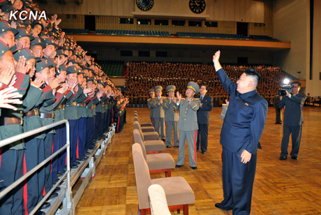 North Korea's top leader Kim Jong Un has a photo session with the participants in the meeting for celebrating the 65th anniversary of Mangyongdae Revolutionary School and Kang Pan Sok Revolutionary School, according to the country's official news agency KCNA's report on Oct. 16, 2012. [Xinhua]