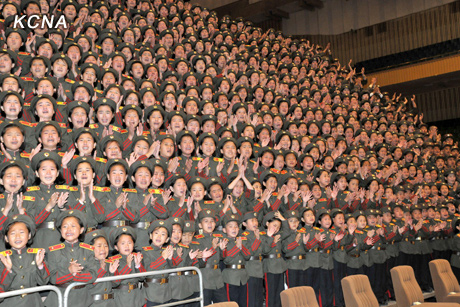 North Korea's top leader Kim Jong Un has a photo session with the participants in the meeting for celebrating the 65th anniversary of Mangyongdae Revolutionary School and Kang Pan Sok Revolutionary School, according to the country's official news agency KCNA's report on Oct. 16, 2012. [Xinhua]