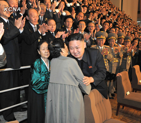 North Korea's top leader Kim Jong Un has a photo session with the participants in the meeting for celebrating the 65th anniversary of Mangyongdae Revolutionary School and Kang Pan Sok Revolutionary School, according to the country's official news agency KCNA's report on Oct. 16, 2012. [Xinhua]