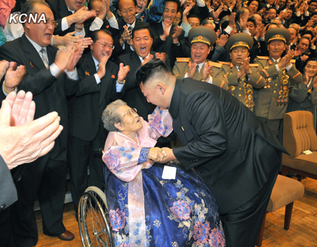 North Korea's top leader Kim Jong Un has a photo session with the participants in the meeting for celebrating the 65th anniversary of Mangyongdae Revolutionary School and Kang Pan Sok Revolutionary School, according to the country's official news agency KCNA's report on Oct. 16, 2012. [Xinhua]