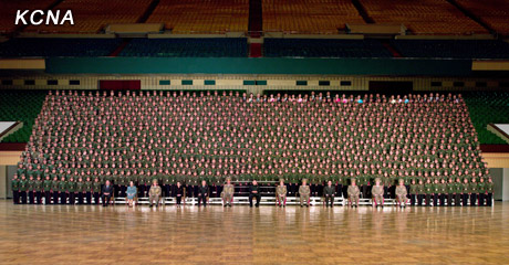 North Korea's top leader Kim Jong Un has a photo session with the participants in the meeting for celebrating the 65th anniversary of Mangyongdae Revolutionary School and Kang Pan Sok Revolutionary School, according to the country's official news agency KCNA's report on Oct. 16, 2012. [Xinhua]