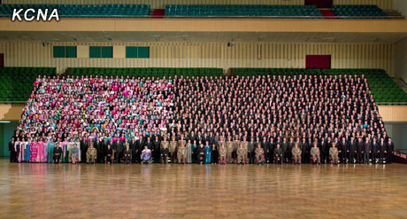 North Korea's top leader Kim Jong Un has a photo session with the participants in the meeting for celebrating the 65th anniversary of Mangyongdae Revolutionary School and Kang Pan Sok Revolutionary School, according to the country's official news agency KCNA's report on Oct. 16, 2012. [Xinhua]