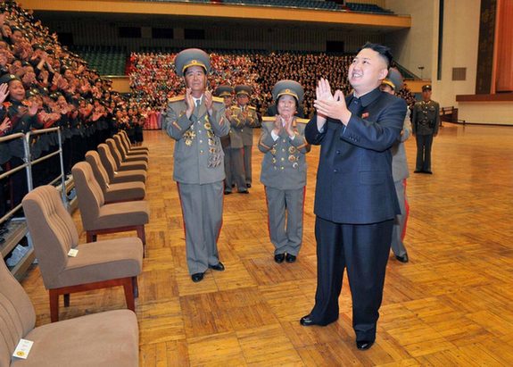 North Korea's top leader Kim Jong Un has a photo session with the participants in the meeting for celebrating the 65th anniversary of Mangyongdae Revolutionary School and Kang Pan Sok Revolutionary School, according to the country's official news agency KCNA's report on Oct. 16, 2012. [Xinhua]