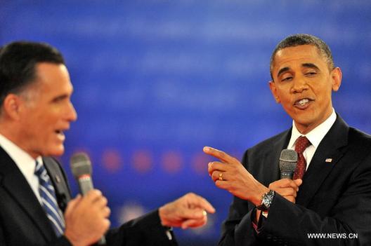 U.S. President Barack Obama (R) and Republican presidential nominee Mitt Romney attend the second presidential debate at Hofstra University in Hempstead, New York state, the United States, Oct. 16, 2012. 