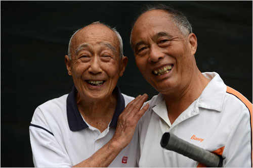 Huang Xingqiao(left) with his tennis partner Li Qizhong, who is in his late sixties on October 18, 2012.