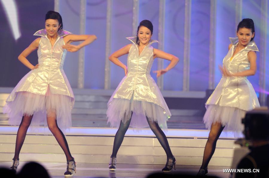 Contestants perform during the finale of 2012 Miss Chinese Cosmos Pageant in Hong Kong, Oct. 27, 2012. A total of twelve contestants participated in the finale.