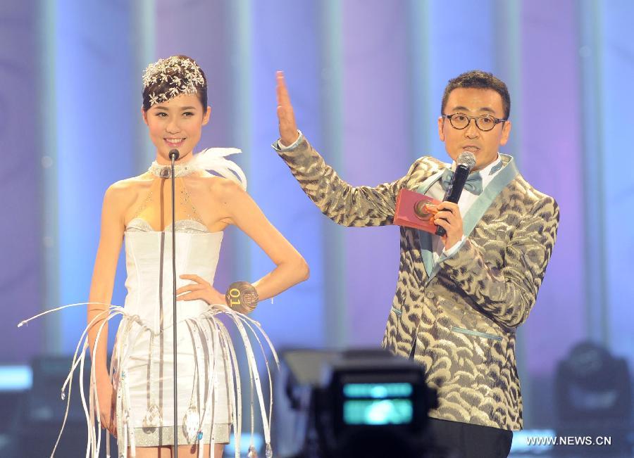 Contestant Fu Xiao attends the question and answer session during the finale of 2012 Miss Chinese Cosmos Pageant in Hong Kong, Oct. 27, 2012. A total of twelve contestants participated in the finale.