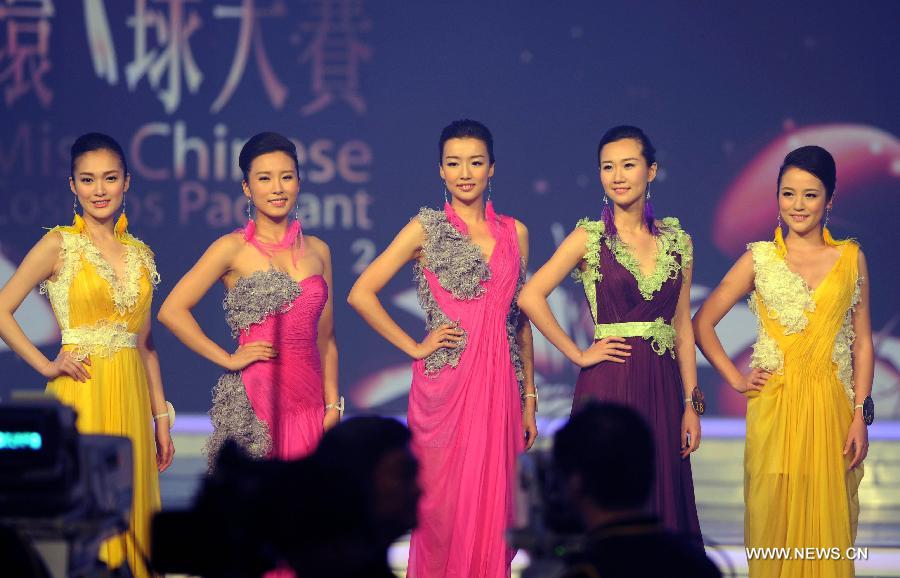 Top five contestants in the finale of 2012 Miss Chinese Cosmos Pageant pose on the stage in Hong Kong, Oct. 27, 2012. A total of twelve contestants participated in the finale.