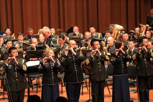 Musicians from China PLA Military Orchestra and the U.S. Army Band 'Pershing's Own' perform during a rehearsal at the National Center for the Performing Arts (NCPA) in Beijing, capital of China, Oct. 29, 2012. A joint concert of the two orchestras were held at the NCPA on Monday.
