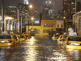 Photo taken on Oct. 29, 2012 shows vehicles in a flooded street in Queens Borough of New York, the United States. Sandy, the 10th hurricane this year, was considered one of the strongest storms ever to affect the U.S. east coast. [Wang Chengyun/Xinhua] 