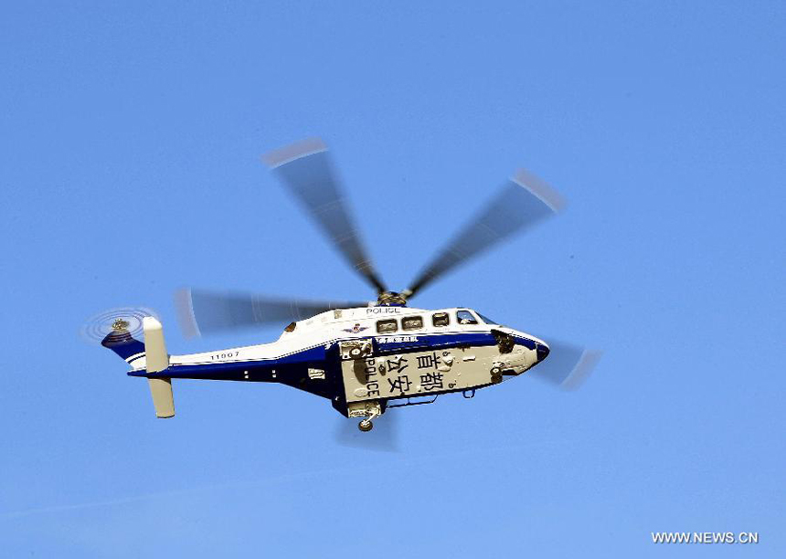 The new helicopter of Beijing police flies in the sky of Beijing, capital of China, Oct. 31, 2012. A new police helicopter of the Beijing Municipal Public Security Bureau conducted its first flight in the city&apos;s suburb on Wednesday. The helicopter is equipped with HDMI wireless image transmission system. 