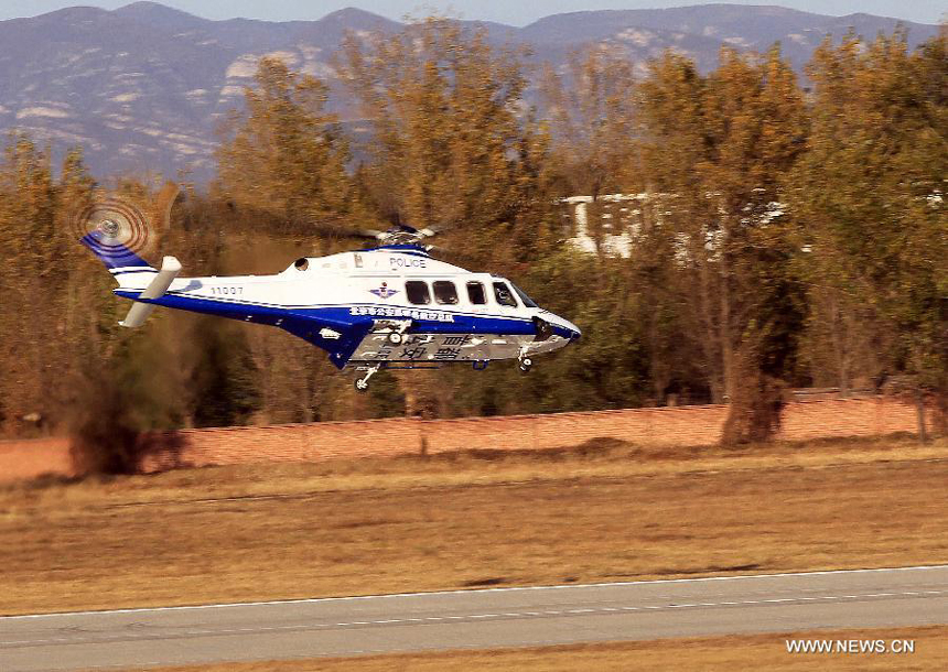 The new helicopter of Beijing police flies in the sky of Beijing, capital of China, Oct. 31, 2012. A new police helicopter of the Beijing Municipal Public Security Bureau conducted its first flight in the city&apos;s suburb on Wednesday. The helicopter is equipped with HDMI wireless image transmission system. 