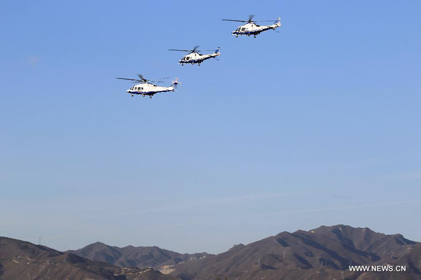 Three helicopters of Beijing police fly in suburb area of Beijing, capital of China, Oct. 31, 2012. A new police helicopter of the Beijing Municipal Public Security Bureau conducted its first flight in the city&apos;s suburb on Wednesday. The helicopter is equipped with HDMI wireless image transmission system.