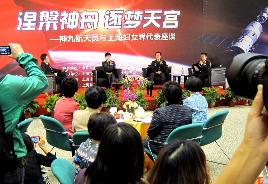 Three Chinese astronauts - Liu Wang, Jing Haipeng and Liu Yang (from right to left) – participate in a discussion in Shanghai on Nov.1 to introduce their experience in training and life in space. The three astronauts were selected to be crew members on the Shenzhou 9 spacecraft. [Xinhua photo]