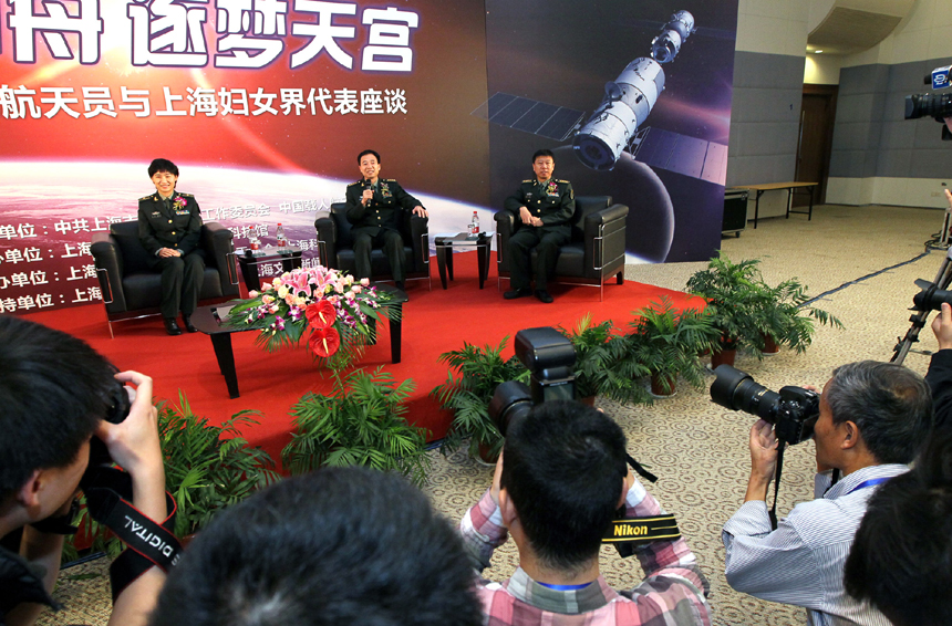 Three Chinese astronauts - Liu Wang, Jing Haipeng and Liu Yang (from right to left) – participate in a discussion in Shanghai on Nov.1 to introduce their experience in training and life in space. The three astronauts were selected to be crew members on the Shenzhou 9 spacecraft. [Xinhua photo]