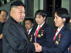 Kim Jong Un and wife watch soccer game
