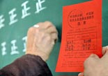 China explores expansion of grassroots democracy