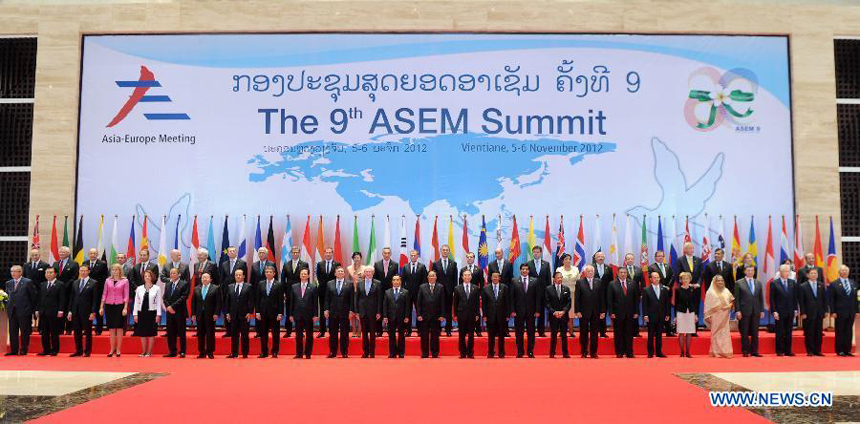 Leaders attending the 9th Asia-Europe Meeting (ASEM) Summit pose for a group photo in Lao capital of Vientiane on Nov. 5, 2012. Chinese Premier Wen Jiabao attended the opening ceremony of the ASEM Summit on Monday. 