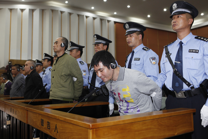 Naw Kham (1st R, front), principal suspect accused in the Mekong River murder case, and five accomplices hear their verdicts at court in Kunming, capital of southwest China&apos;s Yunnan Province, Nov. 6, 2012. Naw Kham was sentenced to death on Nov. 6. The 13 Chinese sailors were murdered after two cargo ships, the Hua Ping and Yu Xing 8, were hijacked on Oct. 5, 2011 on the Mekong River, an important waterway in Southeast Asia. [Xinhua photo]