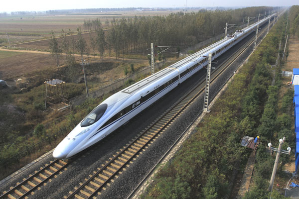 A high-speed train passes through Weifang, Shandong province. Chinese infrastructure companies have already completed projects in developing economies, such as Algeria, Libya and Nigeria. [Photo/China Daily]