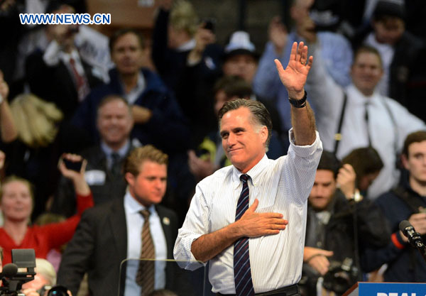 Photo taken on Nov. 5, 2012 shows that Republican presidential candidate Mitt Romney waving during a campaign rally in Manchester, the United States. Romney lost the election in the U.S. presidential race, TV networks including MSNBC projected on Nov. 6, 2012. [Wang Lei/Xinhua]