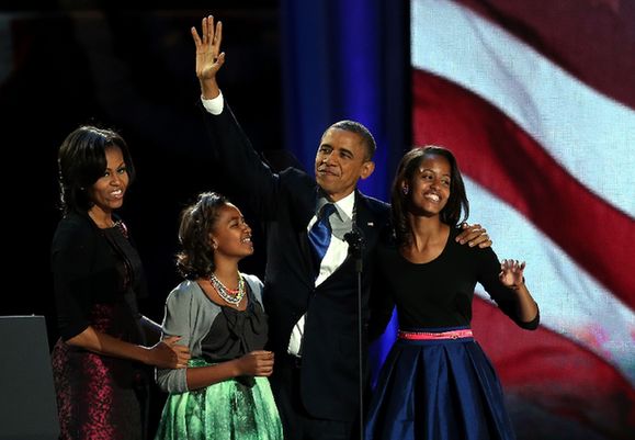 U.S. President Barack Obama walks on stage with first lady Michelle Obama and daughters Sasha and Malia to deliver his victory speech on election night at McCormick Place November 6, 2012 in Chicago, Illinois. Obama won reelection against Republican candidate, former Massachusetts Governor Mitt Romney.[Xinhua] 